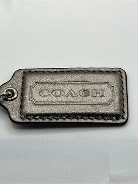 COACH Gray Iridescent Leather Embossed Hang Tag